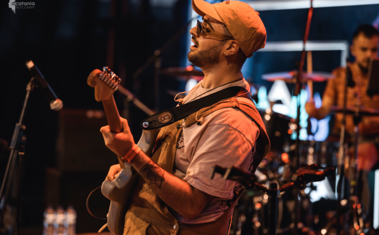 An image showing a guitarist at a live performance